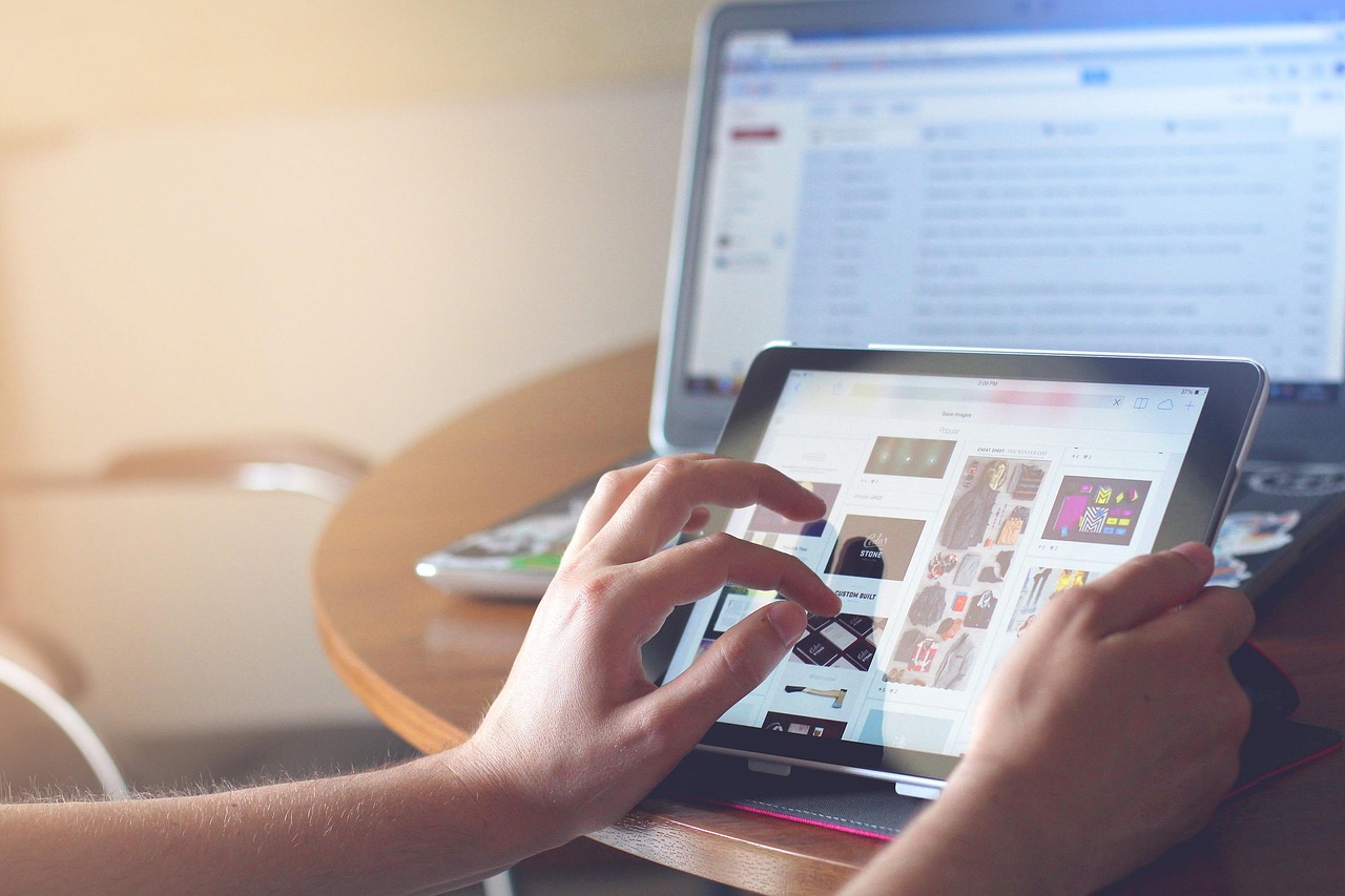 diverse students using tablet devices in modern classroom