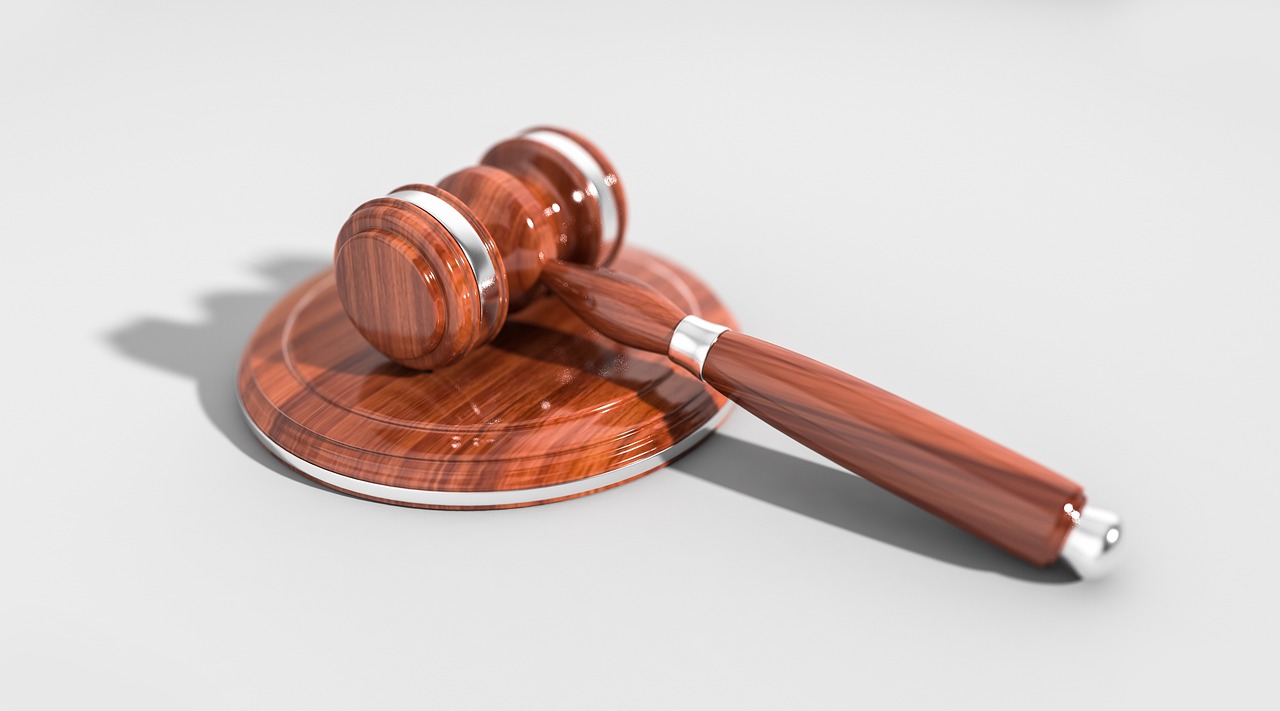 legal gavel with digital circuit board overlay