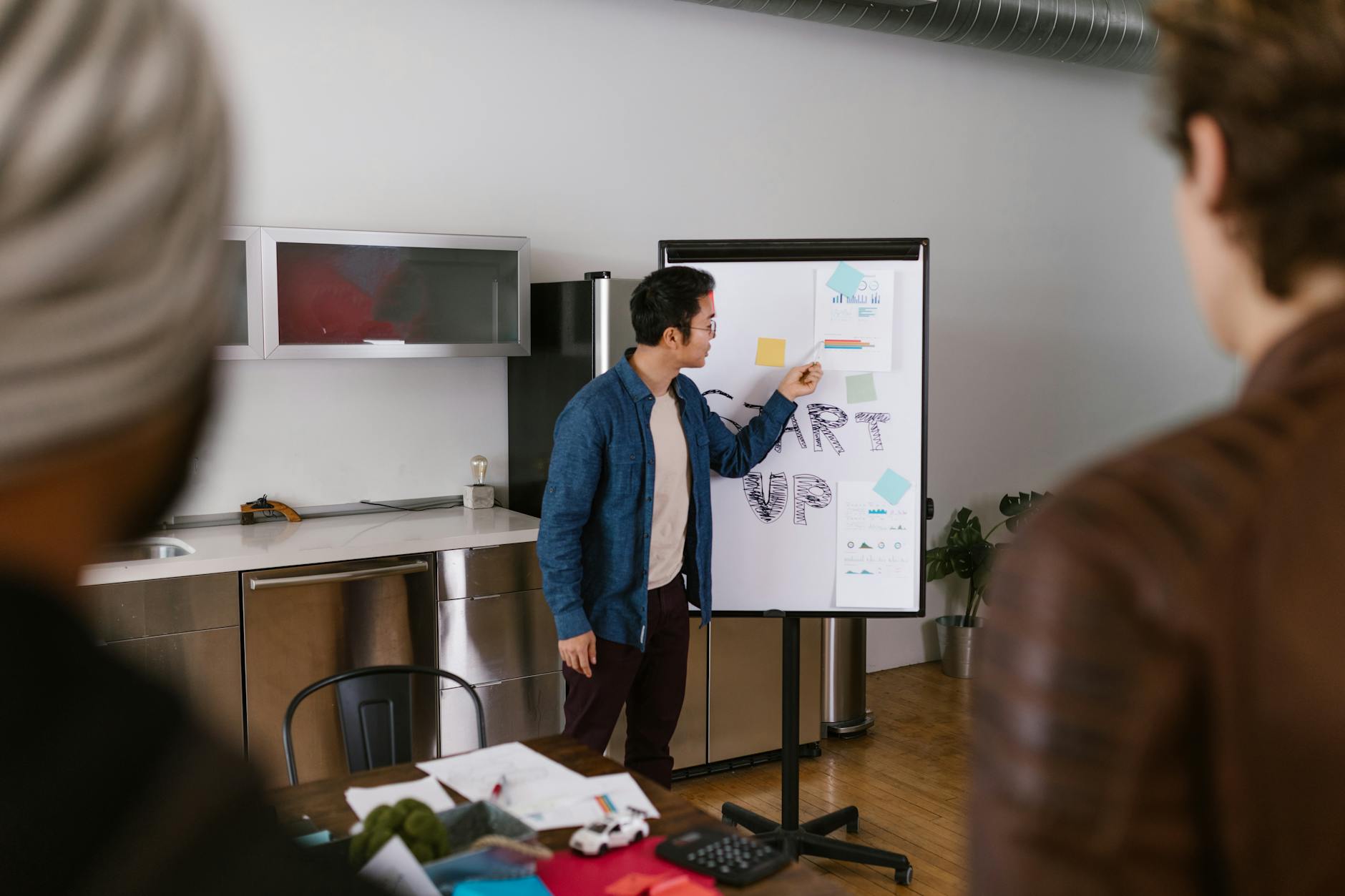 Team members discussing project ideas in a modern office setting.