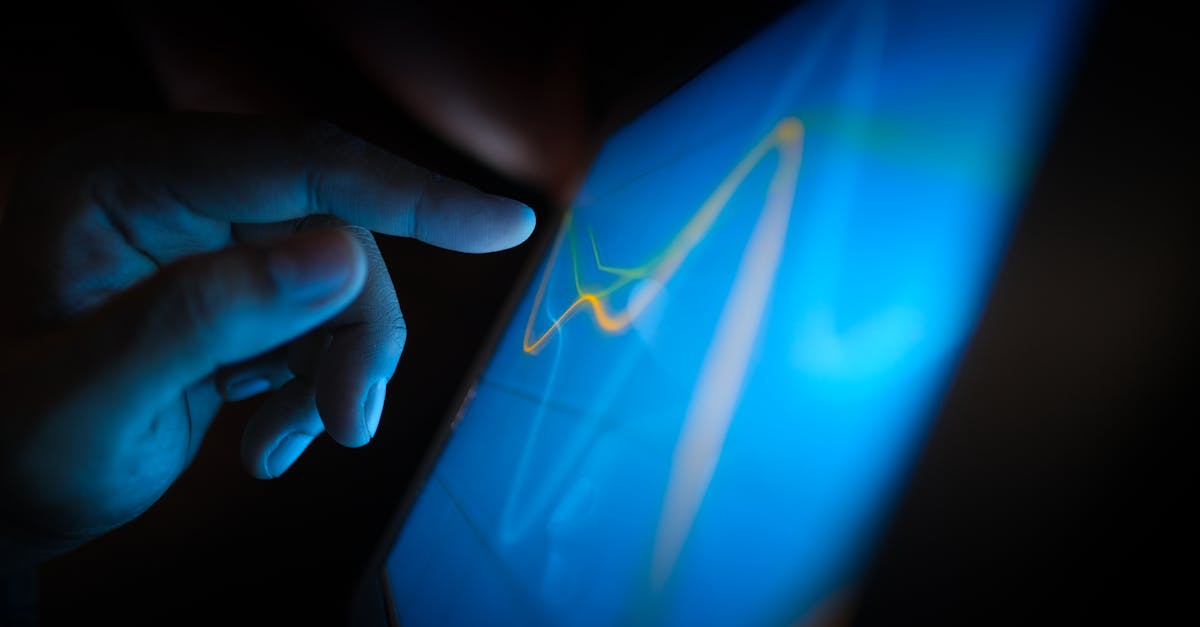 human hand touching holographic digital interface with data analytics