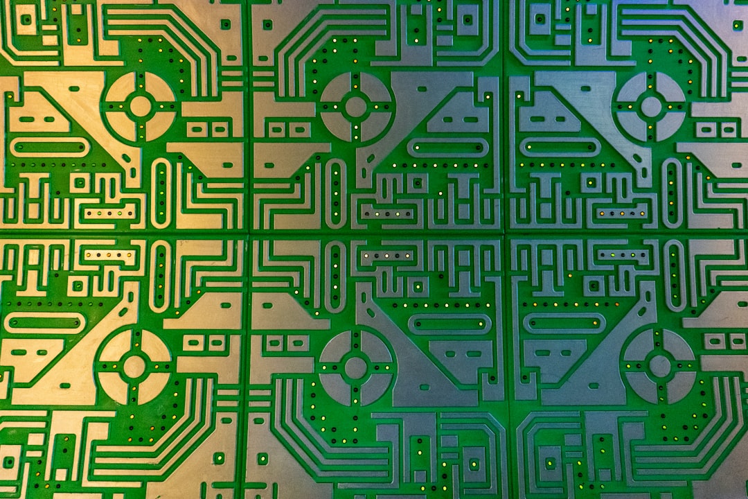 Sustainable AI microchip detail with organic green circuit patterns, solar-powered edge device in nature setting, professional hands holding transparent tablet with carbon footprint metrics, soft natu