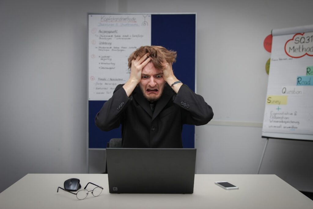 Frustrated data scientist surrounded by chaotic floating holographic data streams in dark server room with blue ambient lighting and neural network visualization overlay