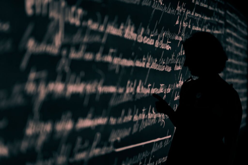 Mathematical theorem glowing on holographic display in futuristic data center, ambient blue lighting, silhouetted researcher observing neural network visualization of abstract algebra, sleek glass sur