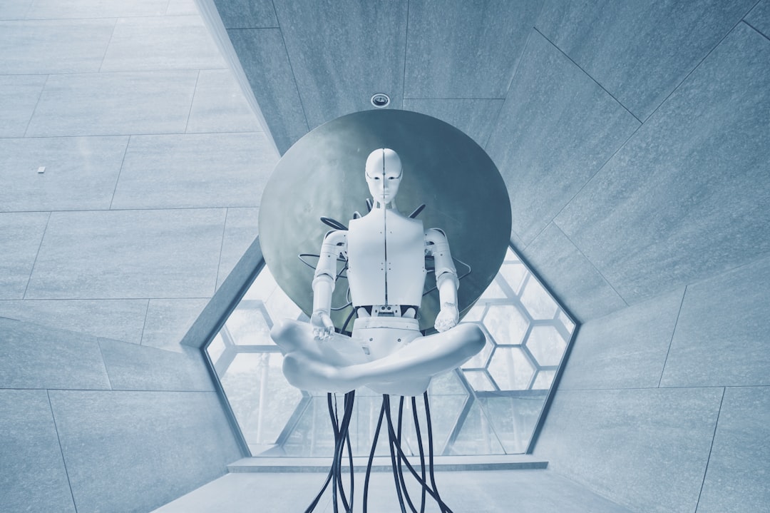 Futuristic humanoid robot with illuminated neural network patterns in chest, facing human hand reaching toward it, dark ambient lighting with cyan and purple glow, clean modern data center background,