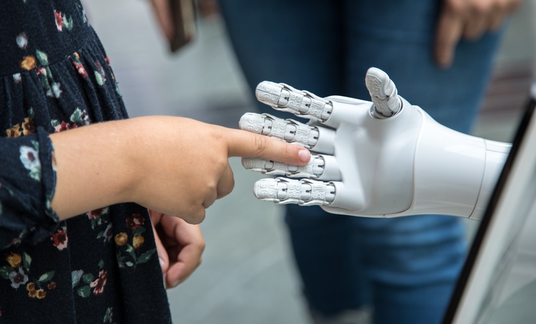 Close-up of robotic hand touching glowing microchip with visible circuit patterns, overlaid with translucent ethical constraint code scrolling, cool blue server room bokeh background, technical precis