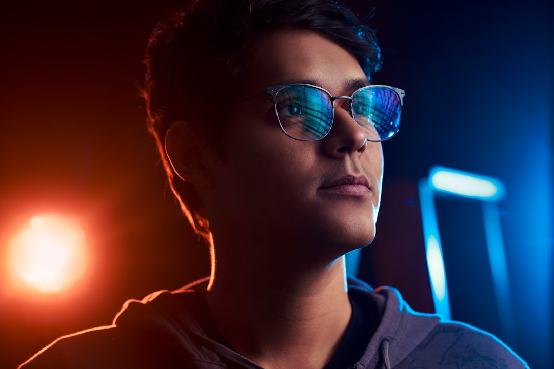 Immersive fan experience with holographic live match stats, person wearing sleek AR glasses, real-time AI engagement dashboard, ambient stadium glow, futuristic crowd visualization, clean modern techn