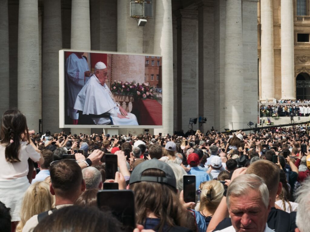 Pope silhouette viewing holographic neural network visualization in sleek Vatican library, ambient blue and gold lighting, futuristic AI ethics concept, human wisdom meets technology