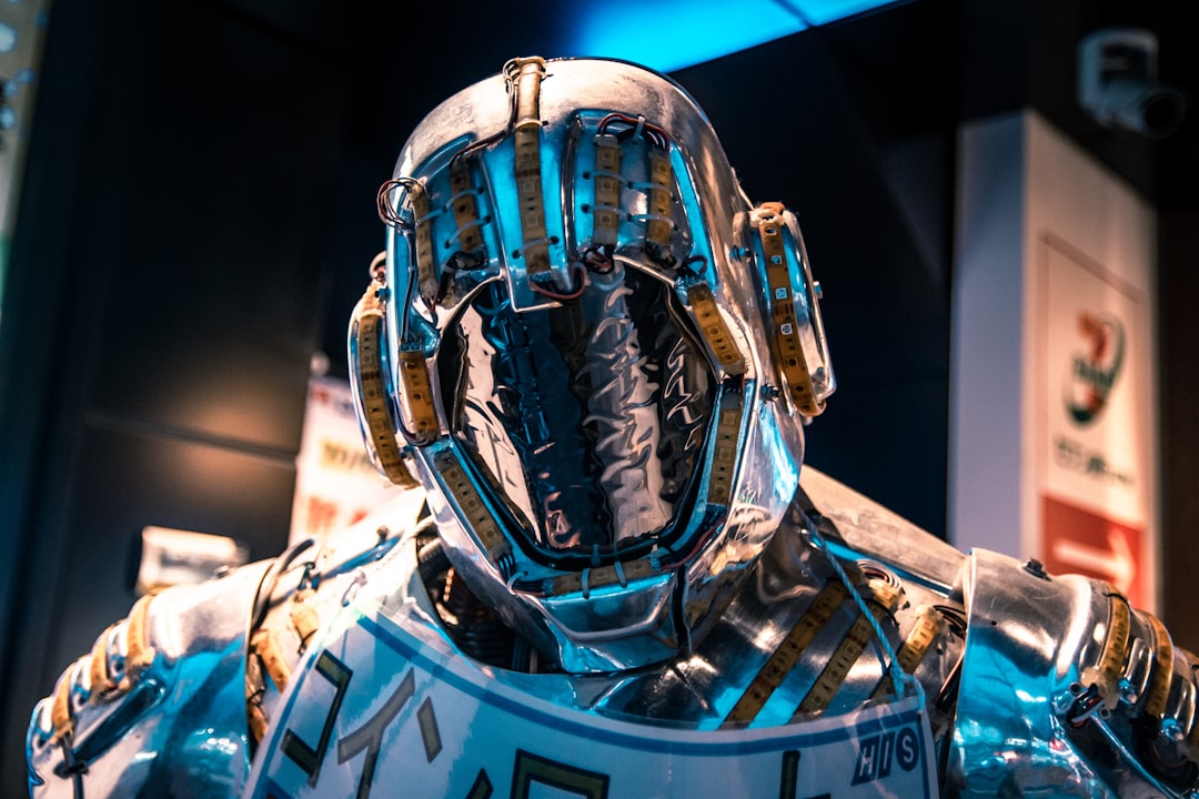 Futuristic AI researcher in sleek glass-walled MIT lab, holographic neural network visualization floating mid-air, ambient blue-white lighting, human-robot collaboration scene, clean modern workspace,