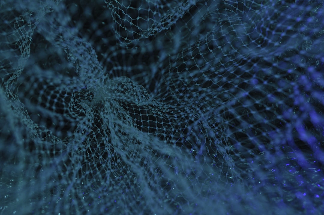 Neural network visualization floating above sleek server room, microchip detail in foreground, blue-green ambient glow, data center cables, professional tech aesthetic, abstract AI processing traffic 