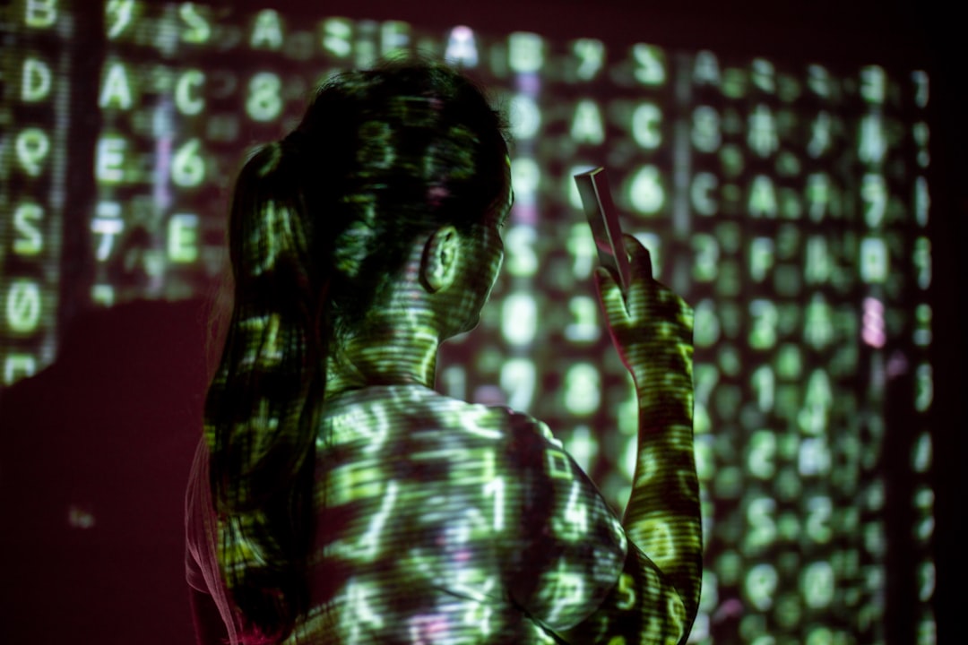 Futuristic cybersecurity dashboard with red alert glow, silhouette of professional woman viewing holographic election data, dark server room ambient lighting, democracy threat concept