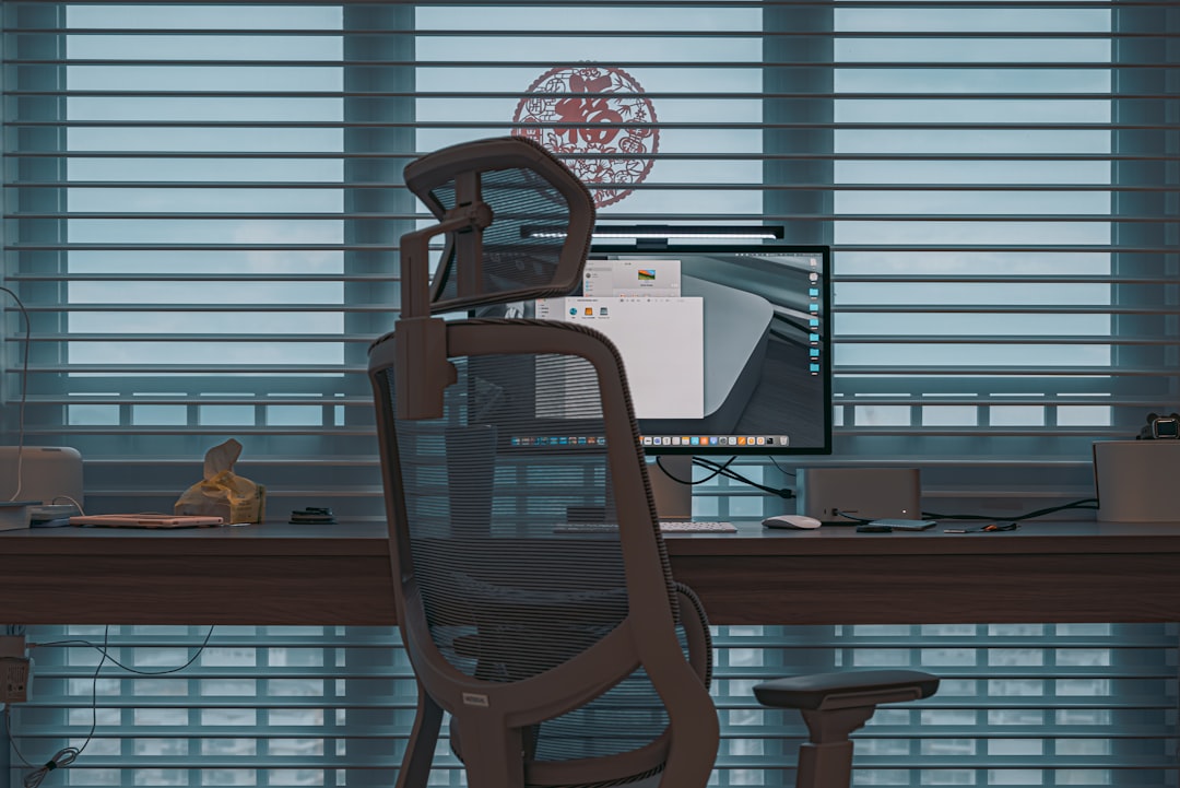 Futuristic boardroom with empty executive chair facing holographic neural network visualization, autonomous AI agent represented by luminous data streams making decisions, sleek dark interface with bl