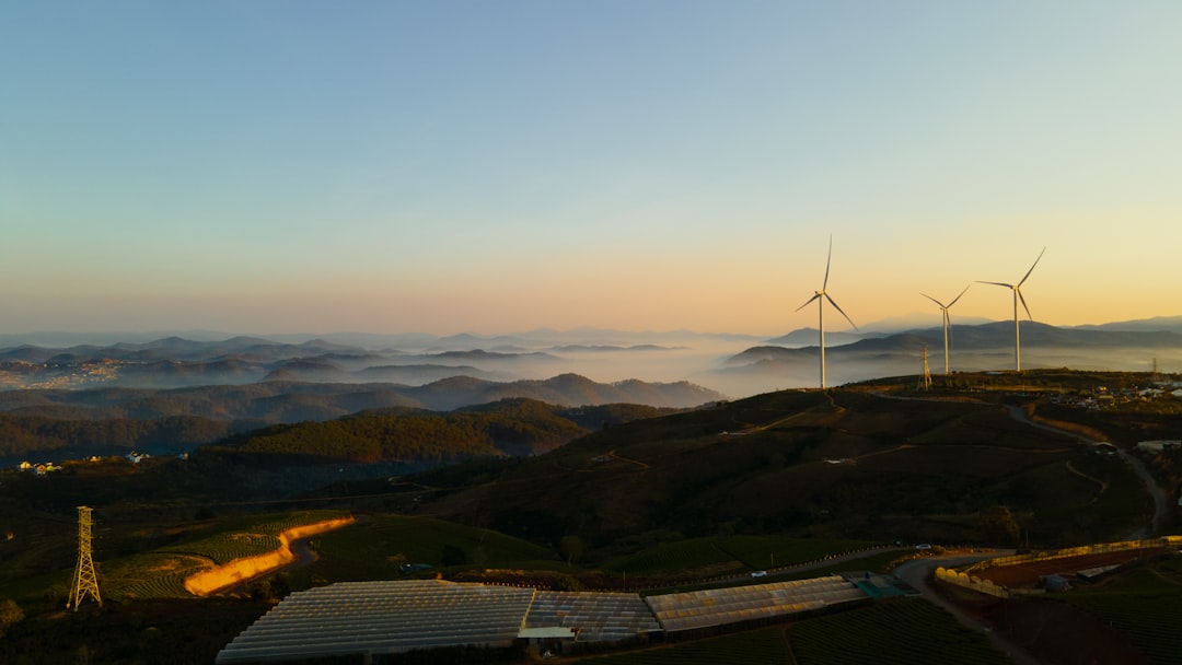Modern Brazilian Northeast wind farm at golden hour with translucent holographic AI neural network floating above, clean energy future concept, sleek professional composition