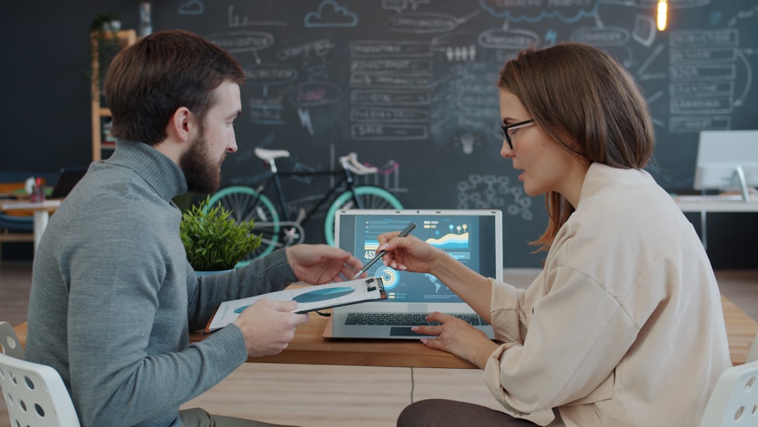Disruptive health tech startup environment, professional team examining holographic sustainable business model visualization, ambient warm and cool lighting contrast, modern minimalist office with liv