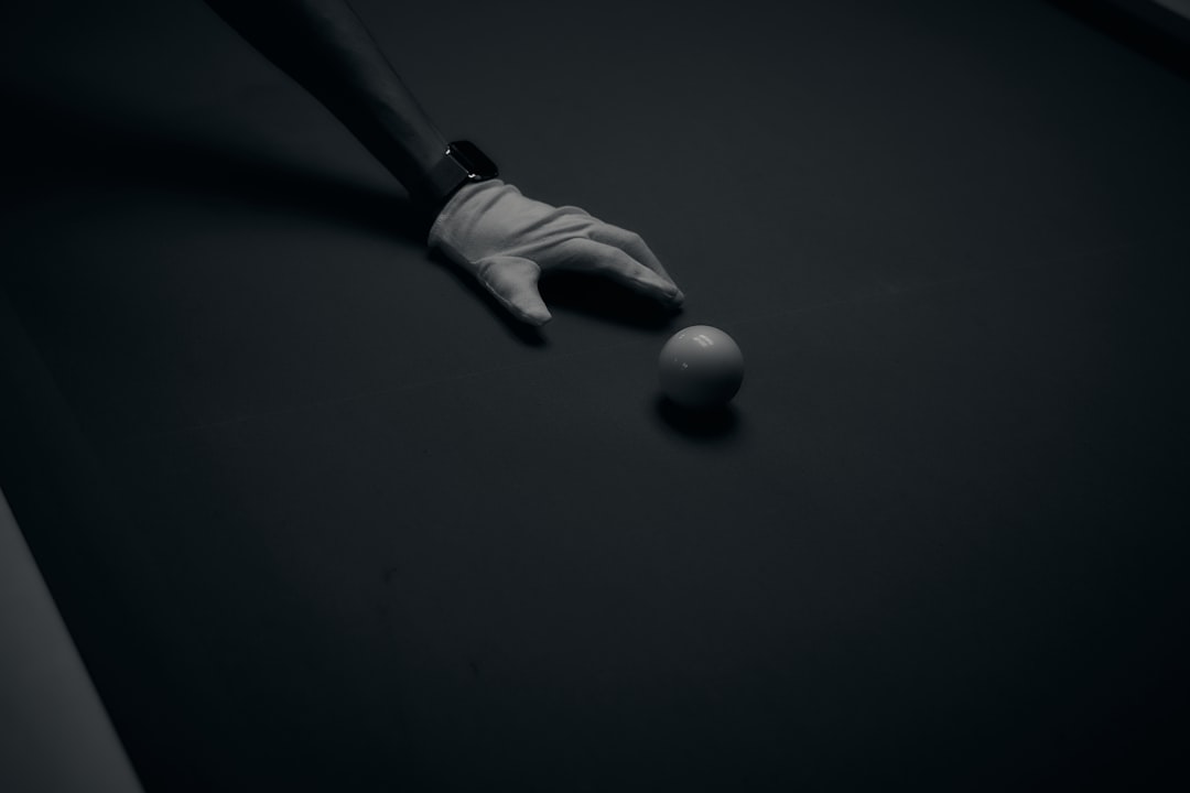 Split-screen conceptual image showing AI ethics dilemma in sports: one half with robotic hand and human hand reaching toward glowing microchip, other half with cybersecurity dashboard and privacy lock