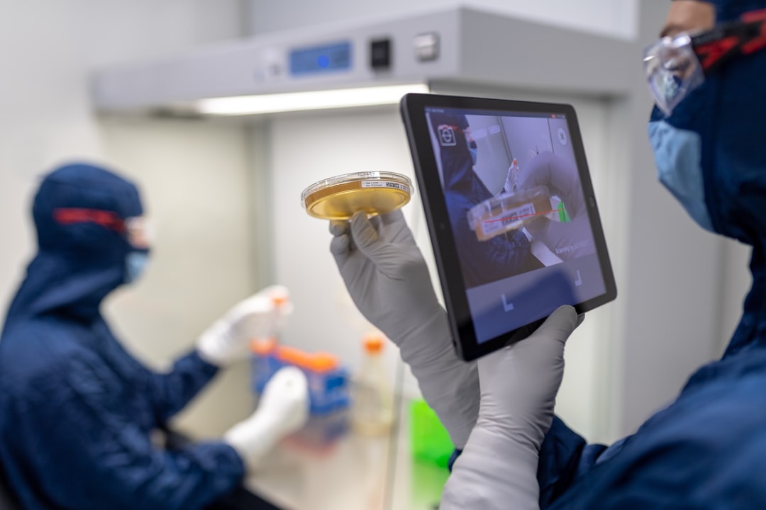 Medical AI robotics in clean modern hospital corridor, doctor collaborating with holographic patient data display, warm clinical lighting, futuristic healthcare technology interface, professional sett