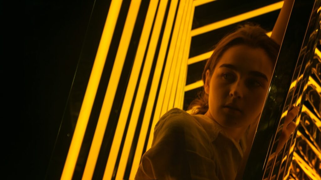 Futuristic data center with glowing server racks and a professional woman examining holographic memory limits display, ambient blue lighting, sleek tech aesthetic