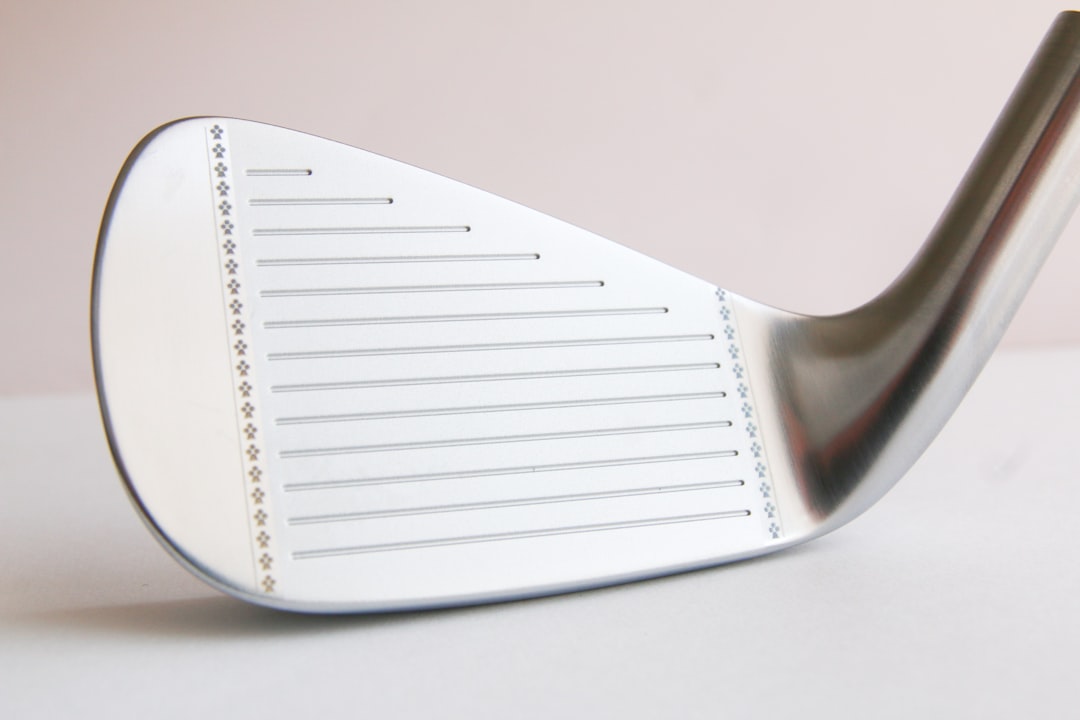 Generative design lab with sleek white surfaces, golf club prototypes materializing from holographic blueprints, AI neural network visualization swirling above, designer hands gesturing at floating 3D