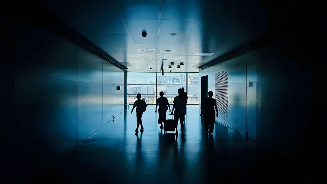 Futuristic corporate boardroom with holographic data visualizations, startup team facing shadowy tech giant silhouettes, dramatic blue ambient lighting, sleek glass architecture, neural network overla