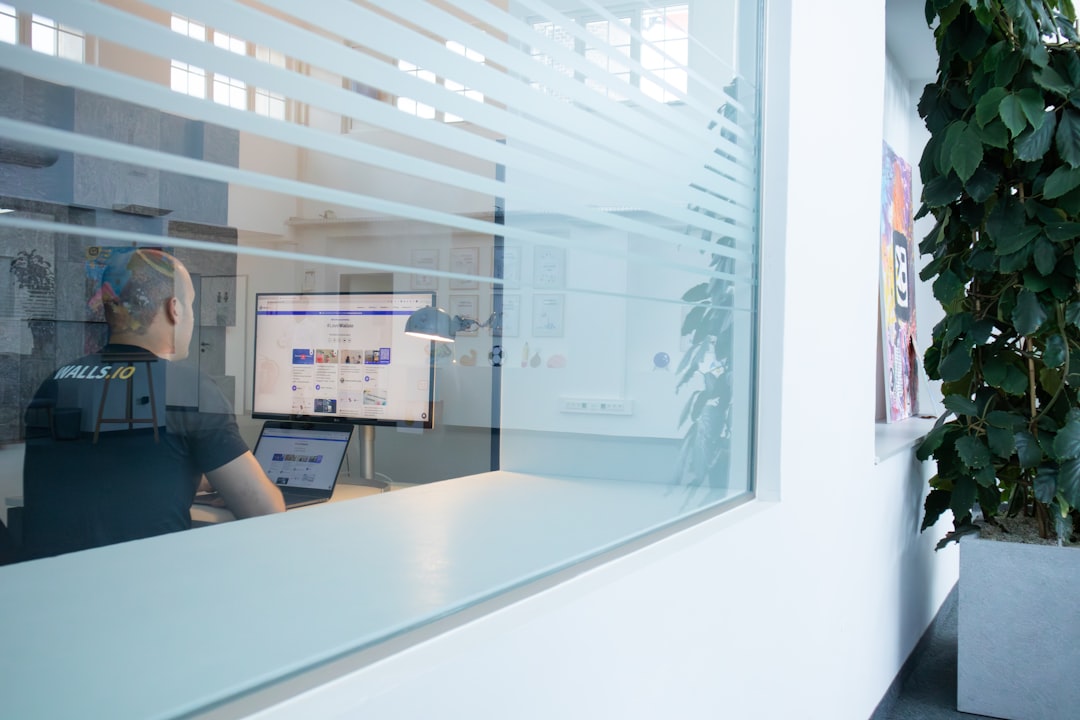 Clean modern office with holographic 2026 timeline display, professional analyst at glass desk, warm ambient lighting, macro economic data floating, sleek futuristic corporate setting