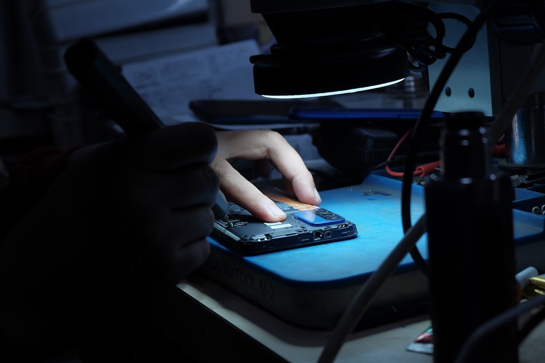 Close-up of advanced microchip and edge computing device, clean modern desk setup, developer hands typing, soft ambient glow, on-device AI processing concept