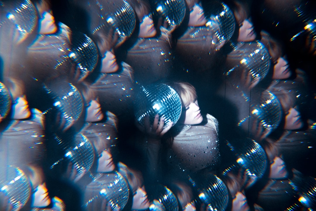 Sleek corporate lobby with holographic AI brain visualization floating above diverse professionals in sharp suits, cool blue ambient lighting, futuristic glass architecture, subtle neural network patt