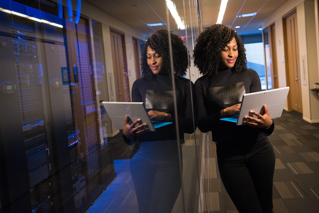 Business executive and data scientist reviewing holographic revenue charts in sleek glass-walled office, warm golden hour lighting through windows, microchip detail reflections, confident professional