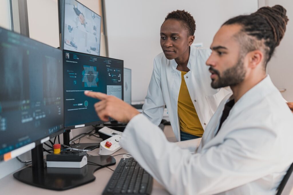 Diverse team of researchers analyzing global data visualizations on holographic displays in sleek modern lab with blue ambient lighting and multiple screens showing world maps and statistics