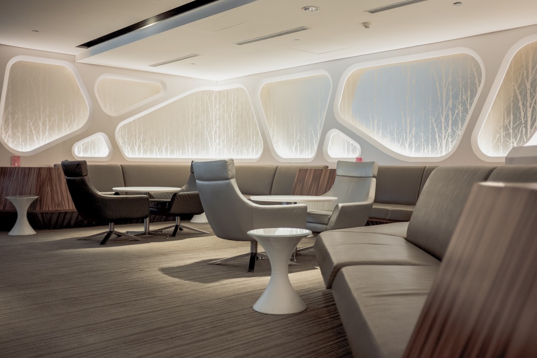 Futuristic diplomatic summit room with holographic world map between London and Beijing landmarks, sleek glass table, ambient blue lighting, professional delegates in discussion, data streams projecte