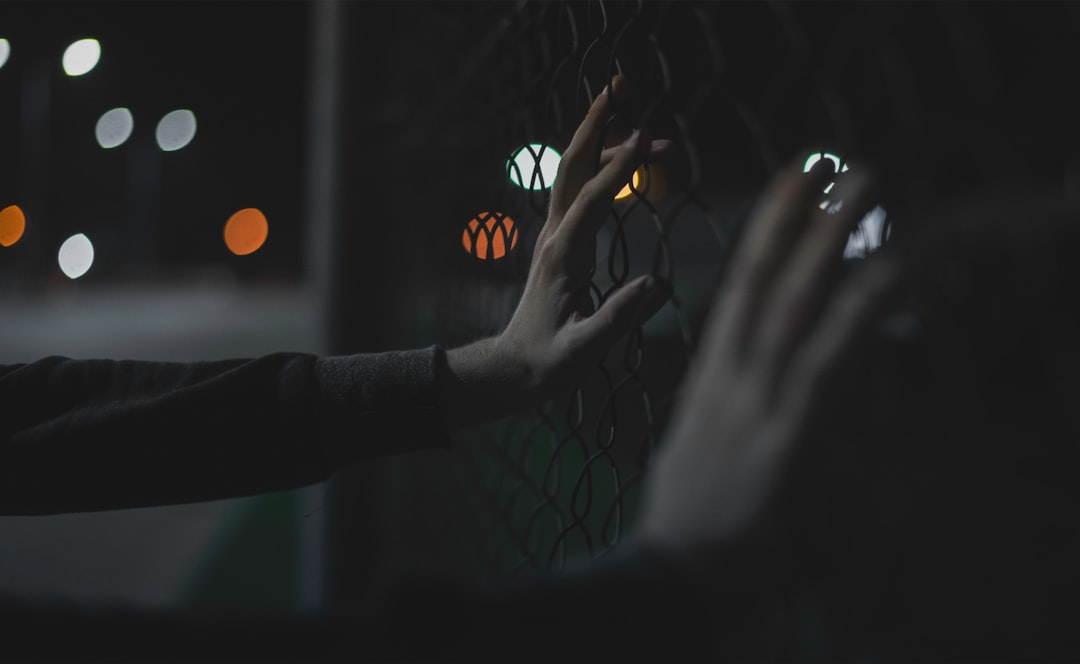 Close-up of diverse professional hands gesturing toward floating hyperpersonalized customer data interfaces, warm ambient lighting, sleek glass screens showing AI-generated content, clean modern offic