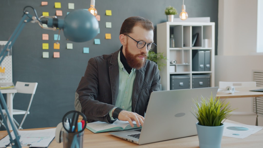 Human-robot collaboration in creative professional workspace, designer and robotic arm crafting together, warm optimistic lighting, futuristic tools, emphasis on augmentation not replacement
