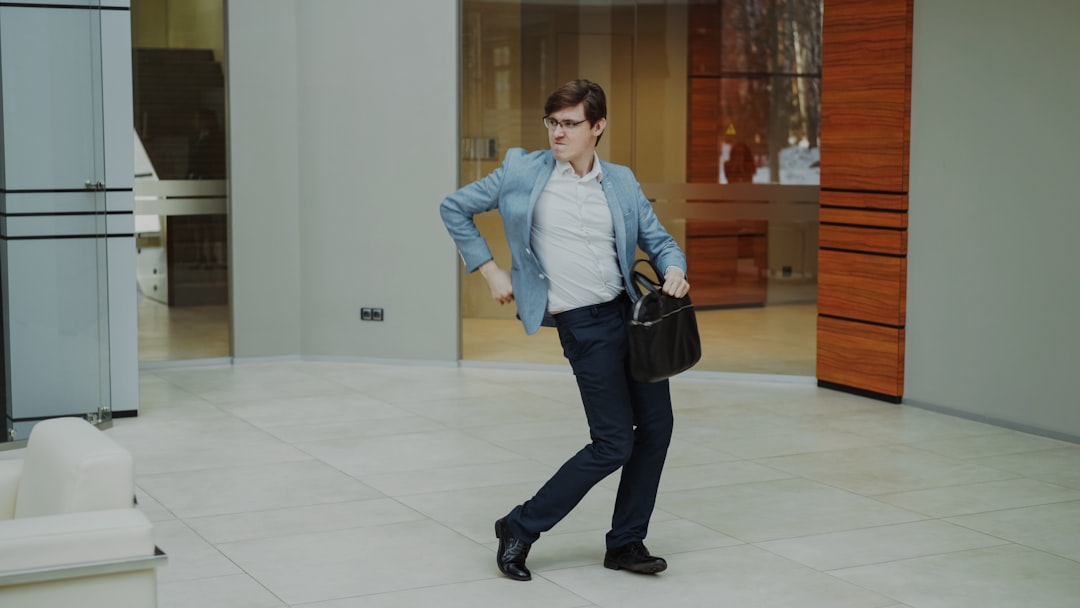 Professional woman shaking hands with humanoid robot in sleek corporate lobby, holographic career paths floating between them, golden ambient lighting, future of work