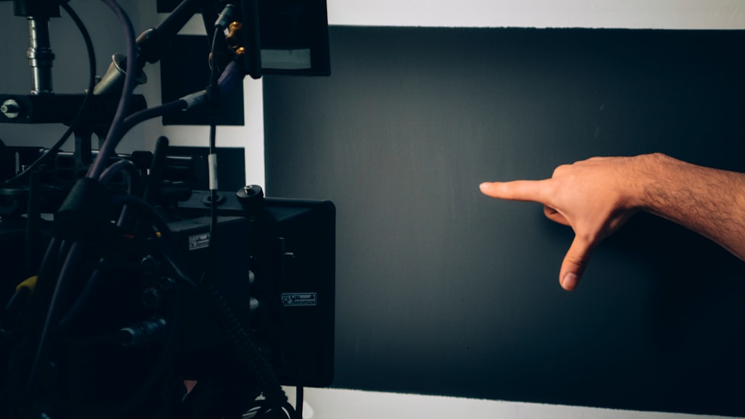 Human hand touching glowing AI ethics circuit board, split composition with dark server room and bright hopeful horizon, dramatic neon lighting, cybersecurity dashboard reflections, abstract neural ne