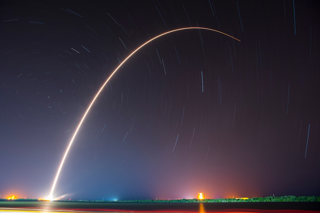 Sleek rocket launch trajectory visualized through holographic AI interface, neural network overlay on space telemetry, dark mission control room, ambient cyan lighting, professional aerospace technolo