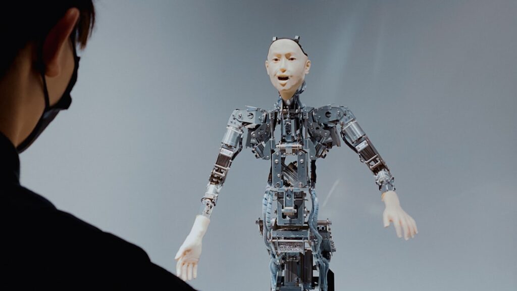 Close-up of sleek humanoid robot gently assisting elderly woman in futuristic smart home, soft ambient lighting, holographic medical data floating between them, warm and cool tones blending