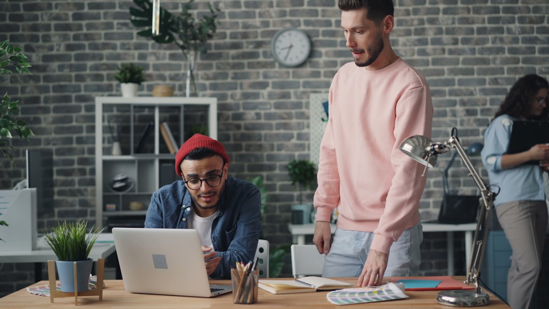 Diverse group of tech ethicists in clean modern office, AI ethics concept visualization with privacy lock icons, holographic display showing inclusive AI framework, warm professional lighting, human-c