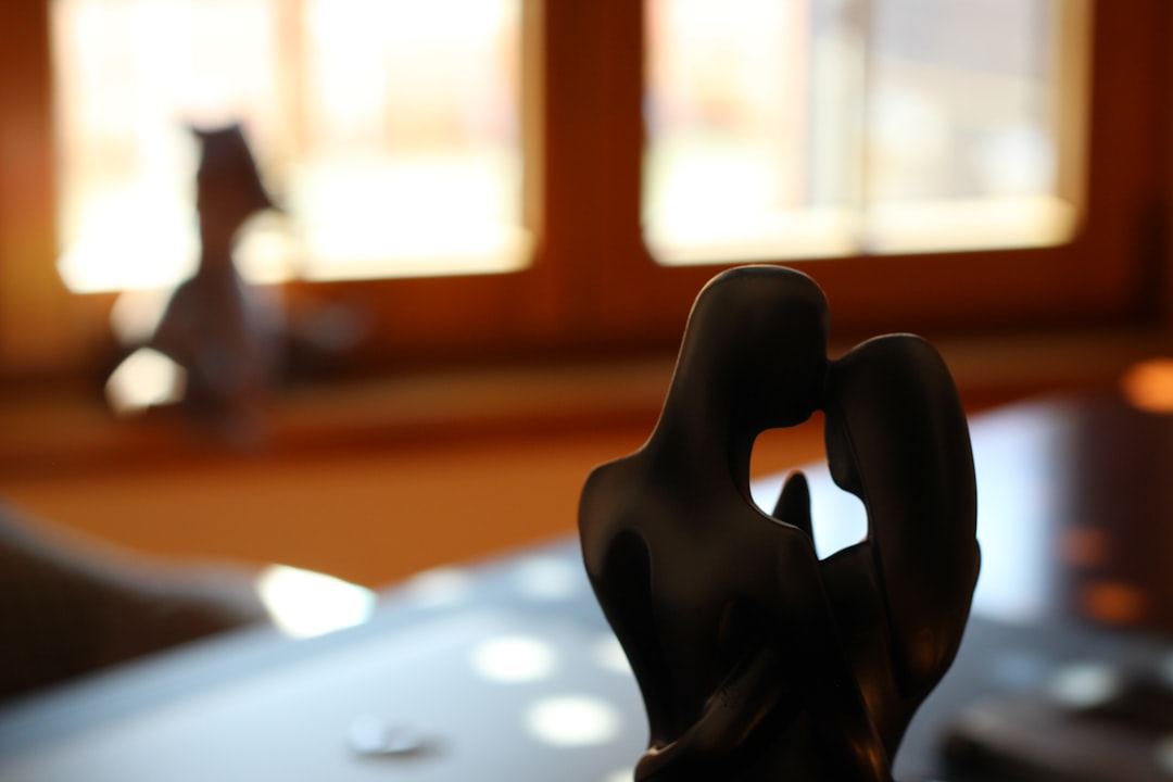 Robotic arm and human hand collaborating on repetitive paperwork tasks, clean modern office with warm ambient lighting, motion blur on automated processes, sharp focus on human face showing relief, ed