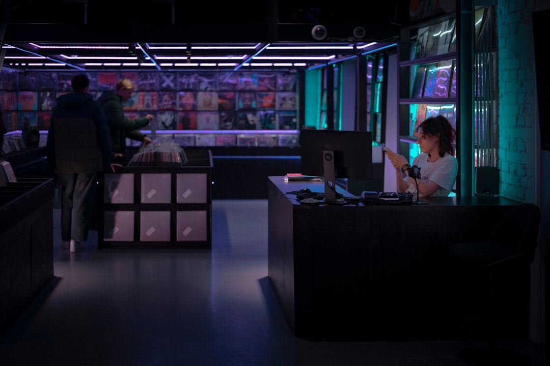 Sleek futuristic government office with holographic data dashboards, professional analyst reviewing cost metrics, cool blue ambient lighting, neural network visualization floating above clean modern d