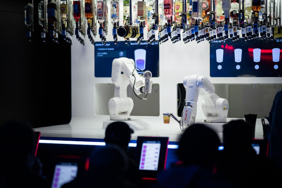 Human robot collaboration in clean modern workspace, professional worker alongside robotic arm, holographic displays showing skill augmentation, warm ambient lighting, sleek futuristic manufacturing o