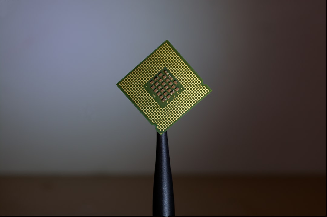 Extreme close-up of revolutionary microchip wafer with illuminated circuit pathways, holographic financial data streams, clean modern server room background, cool cyan and silver professional lighting