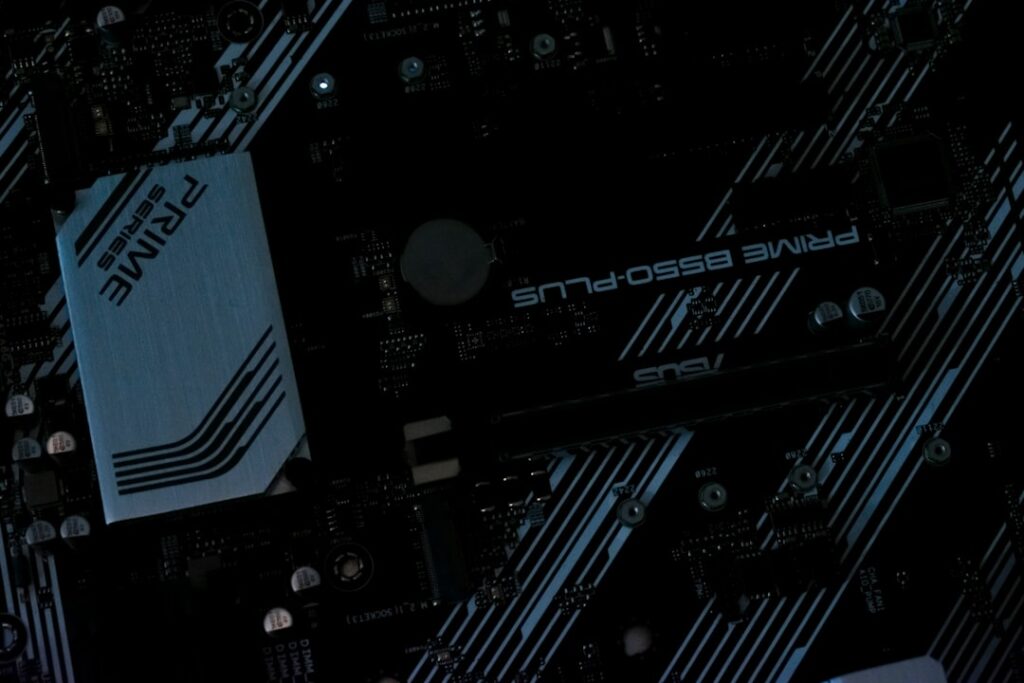 Macro close-up of futuristic NVIDIA Blackwell-X chip with holographic neural network overlay, sleek ambient blue-green lighting, clean dark background, technical precision, data center bokeh