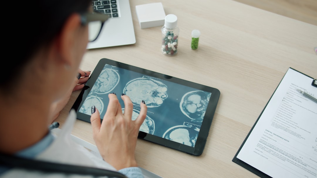 Medical professional reviewing holographic brain scan with AI diagnostic interface, clean modern hospital lab, soft blue ambient glow, neural network visualization, futuristic health technology scene