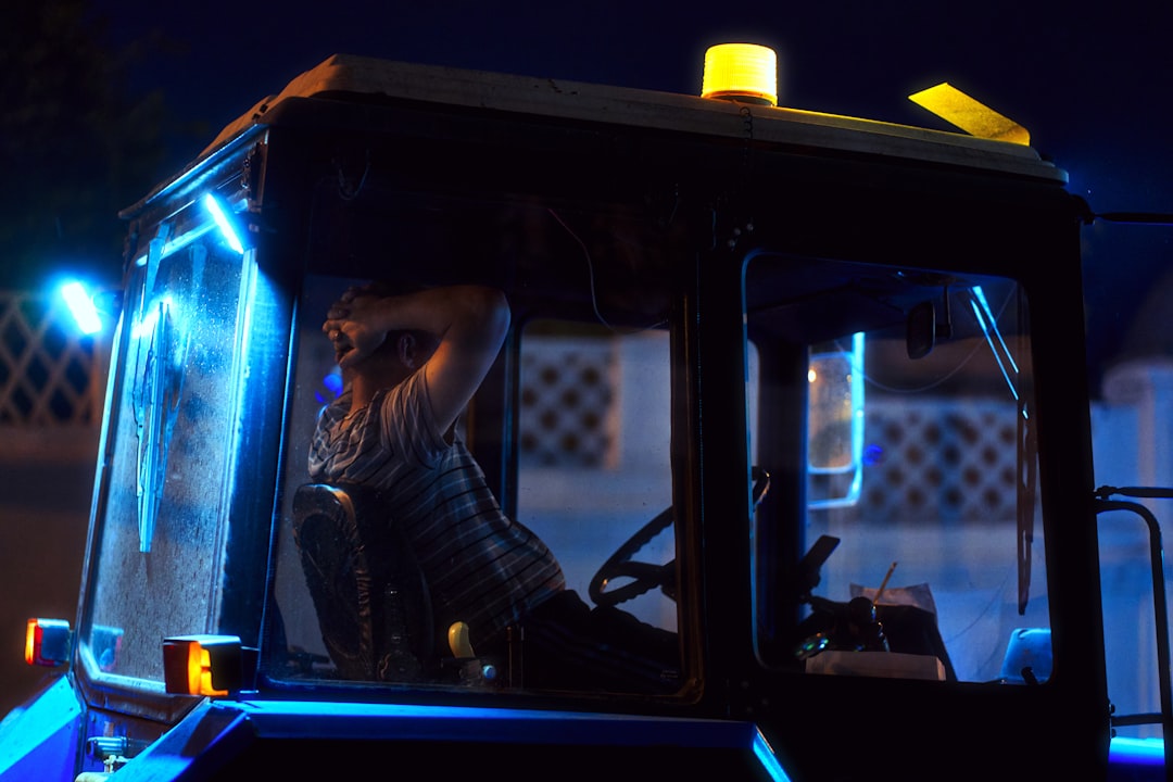 Sle human-robot collaboration in sleek modern agricultural command center, autonomous tractor holographic display, global network connections on screens, professional ambient lighting, microchip detai