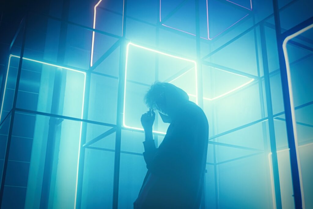 Futuristic server room with holographic data streams, professional engineer silhouette, cool blue ambient lighting, sleek infrastructure, technology transition concept, clean modern data center