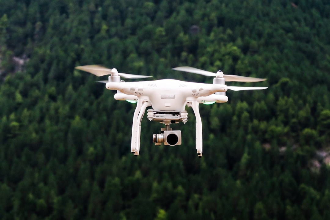 Drone with multispectral sensors hovering over lush tropical crop field, professional agronomist analyzing tablet data, golden hour ambient lighting, sleek green technology overlay, sustainable precis