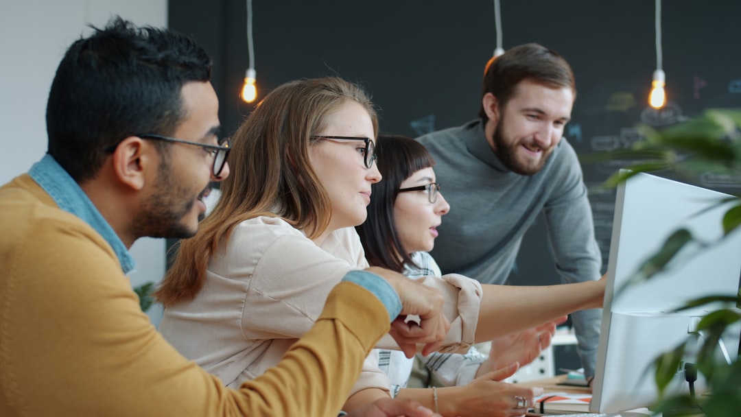 Hyperpersonalized automation dashboard with holographic employee profiles and AI analytics, diverse team interacting with floating data displays, warm ambient lighting, contemporary corporate workspac