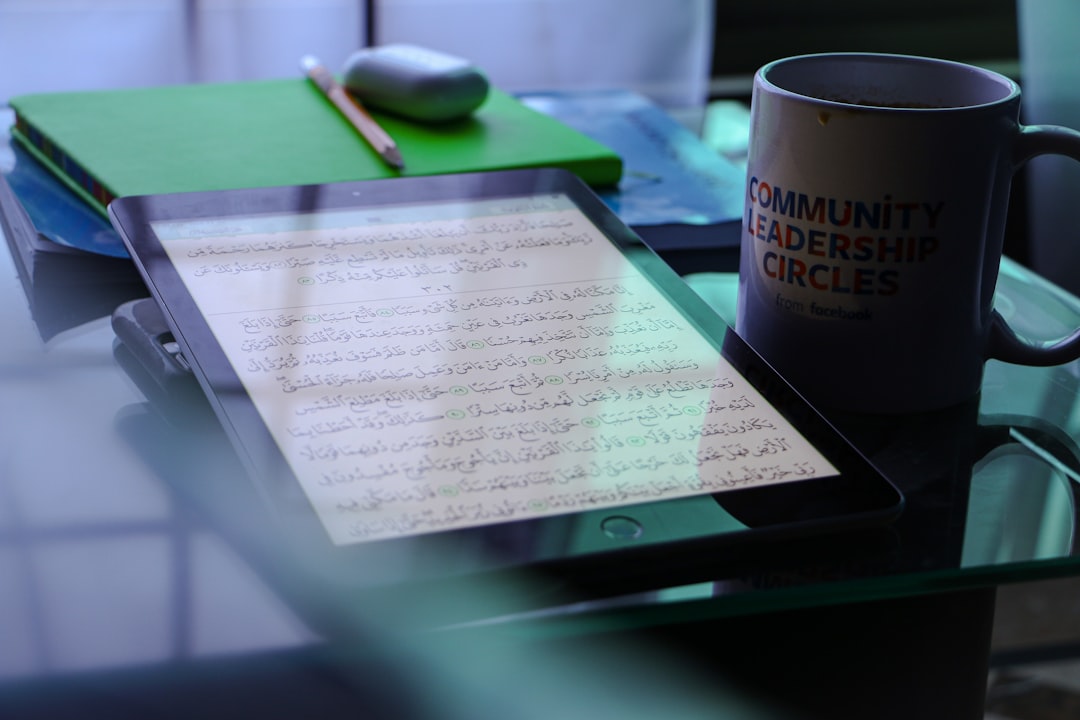 Close-up of vintage legal documents and modern digital tablet showing AI code, warm ambient lighting, blurred government building background, symbolizing legislative evolution