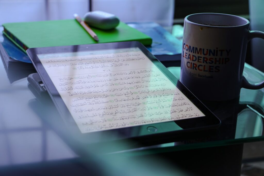 Close-up of vintage legal documents and modern digital tablet showing AI code, warm ambient lighting, blurred government building background, symbolizing legislative evolution