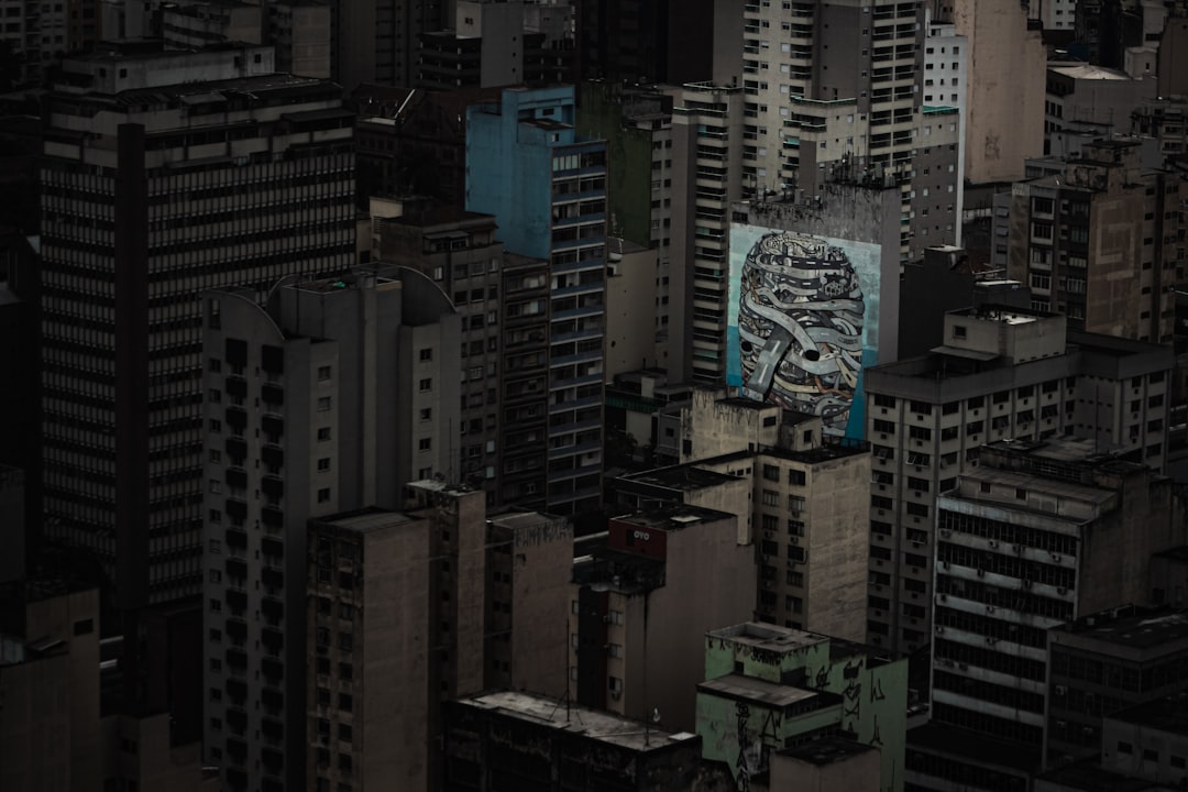 Futuristic Brazilian cityscape with holographic data visualizations and neural network overlays, sleek ambient lighting, professional analyst examining AI metrics on transparent display, clean modern