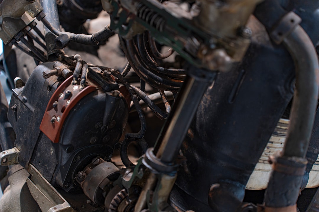 Aircraft engine with microchip detail overlay, maintenance technician using tablet with predictive analytics dashboard, clean modern hangar, holographic diagnostic data, professional ambient lighting,