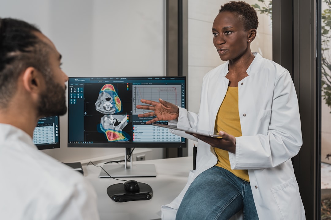 Human-robot collaboration in medical AI setting with holographic patient scans and professional doctor interacting with sleek futuristic interface display